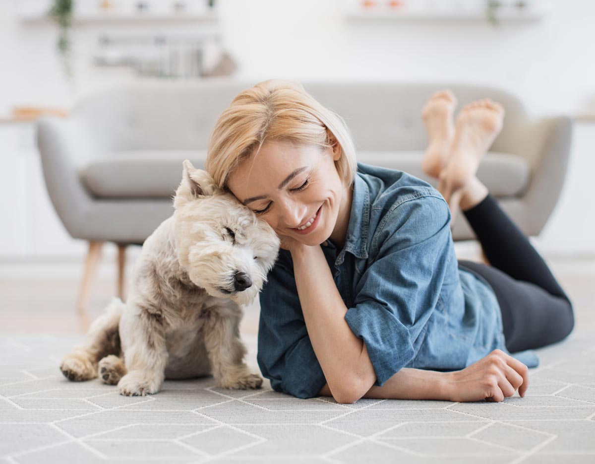 Pet Owner Snuggling Dog